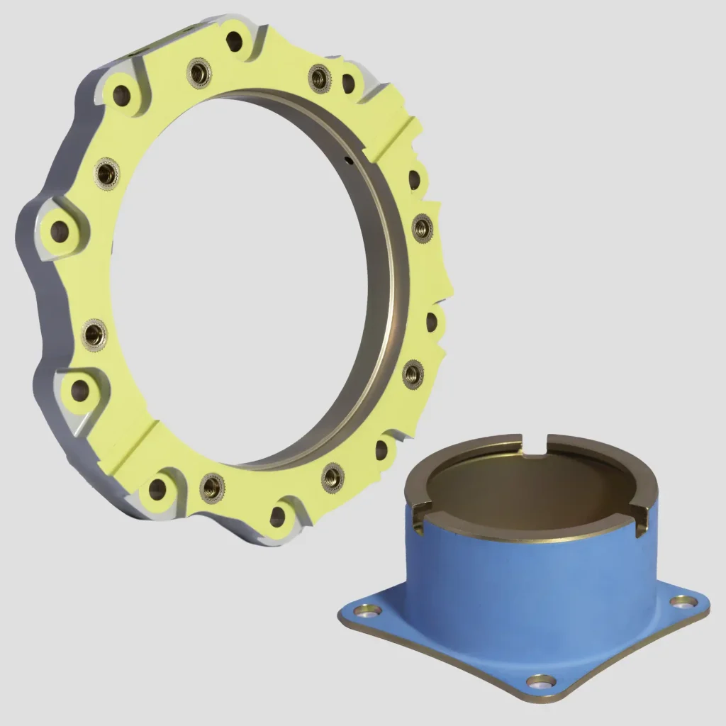 A metal circular ring with yellow coating and multiple screw holes, next to a blue cylindrical base with bolt holes.